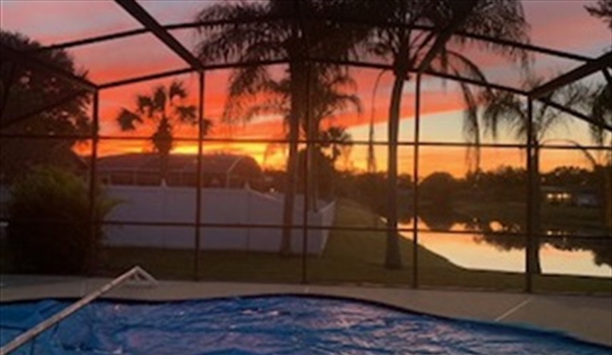 Sunset view from pool area. FLORIDA HOME in Pine Chase Estates, St Cloud, Gulf Coast
