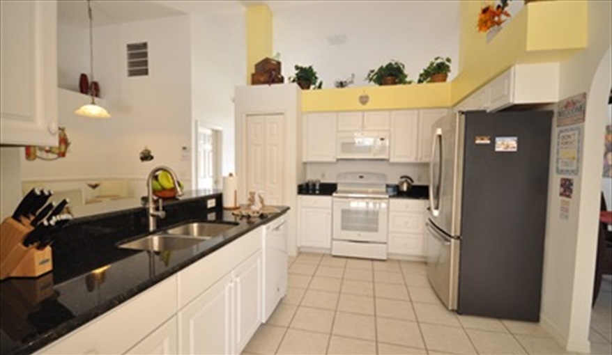 Open plan with the Family lounge and the dining area.. Palm Tree Villa - Pool Lift, 5 STAR RATING in Doral Woods, Kissimmee, Orlando