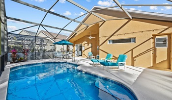 Private screened pool with sunny lounge seating. For the Best Disney Vacation-Tropical Paradise Villa in Emerald Island Resort, Kissimmee, Orlando